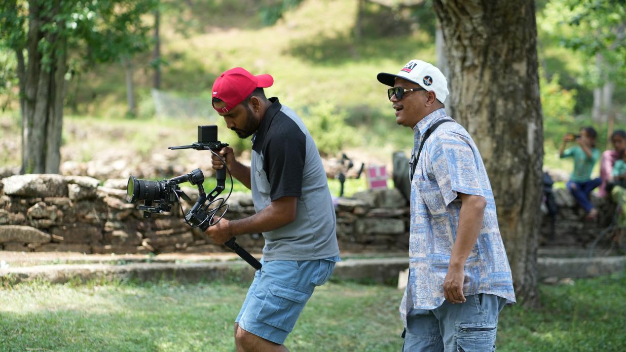 Mashakbeen camera operator filming on location